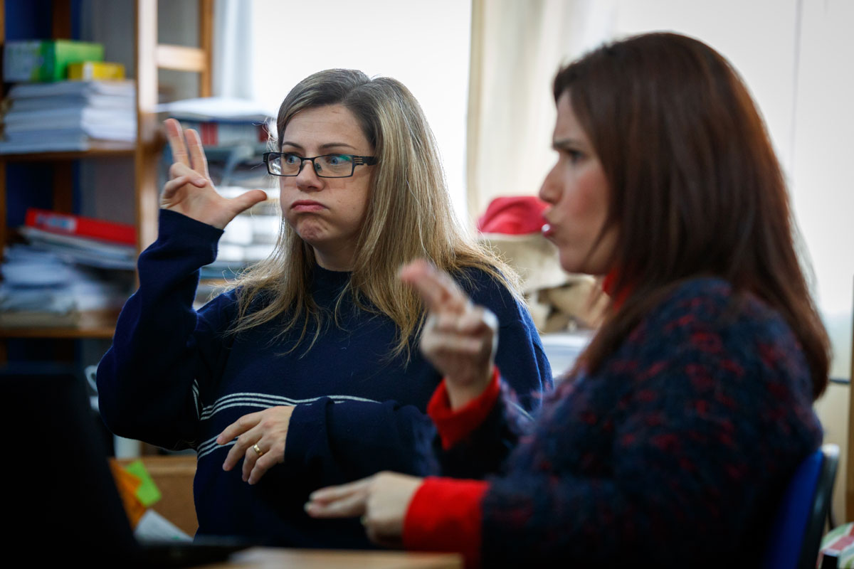 Spain two women using sign language